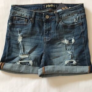 Indigo Rein Mid Rise women short with distress look.